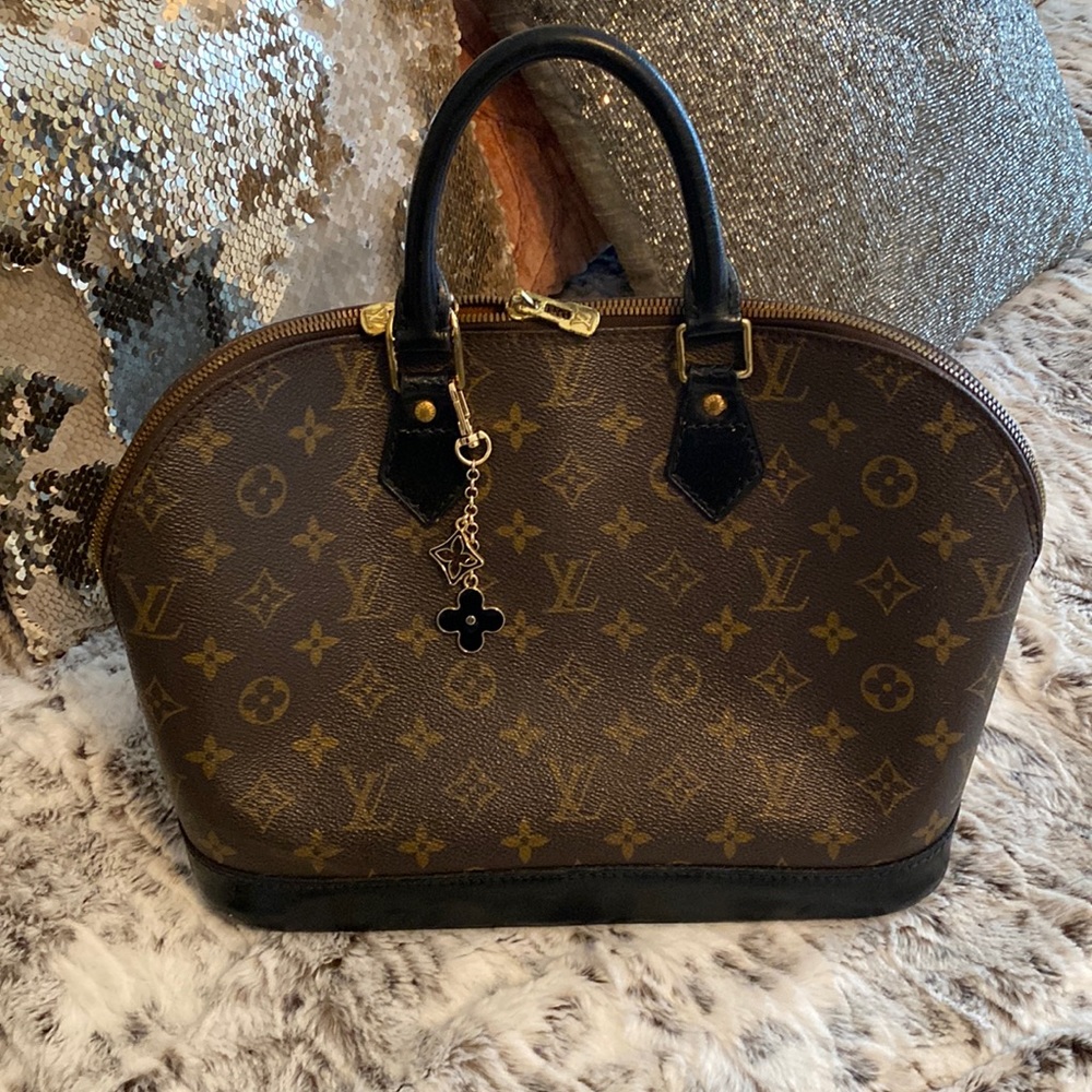 Authentic Black monogram Louis Vuitton Alma bag.